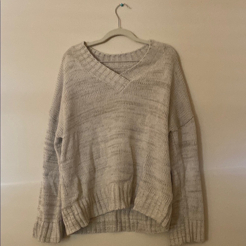 Cream V-Neck Sweater with Elegant Design